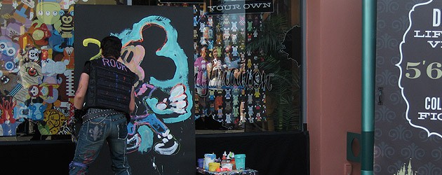 Speed painter Rock Demarco paints Mickey Mouse at the D-Street grand opening