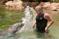Survivor Villain Russell Hantz gets a splash from Dexter, Discovery Cove Orlando's dolphin