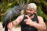Survivor Villain Russell Hantz meets Discovery Cove's black palm cockatoo, Torre