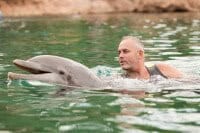 Survivor first winner Richard Hatch with Dexter, at Discovery Cove in Orlando