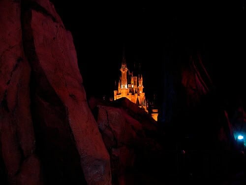 Cinderella Castle hidden behind Tomorrowland rocks