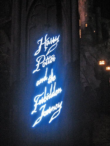 Harry Potter and the Forbidden Journey sign at night in the Wizarding World of Harry Potter