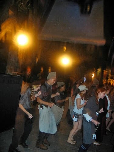 Three Broomsticks staff and attendees do the "Cha Cha Slide"