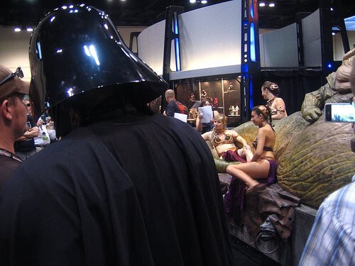 Darth Vader looks on at Slave Leias