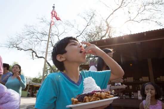 Boy eating funnel cake